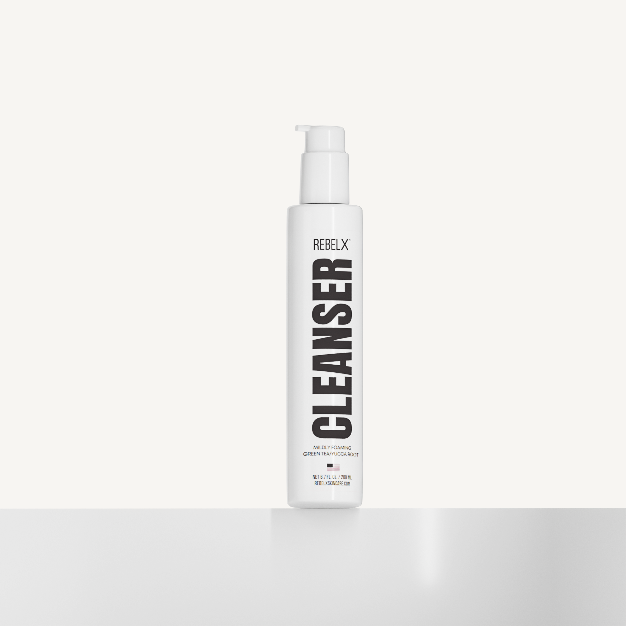 REBELX Cleanser with mildly foaming green tea and licorice root in white pump bottle, 6.7 fl oz size