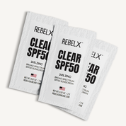Three packages of RebelX Clear SPF50 sunscreen on a white background