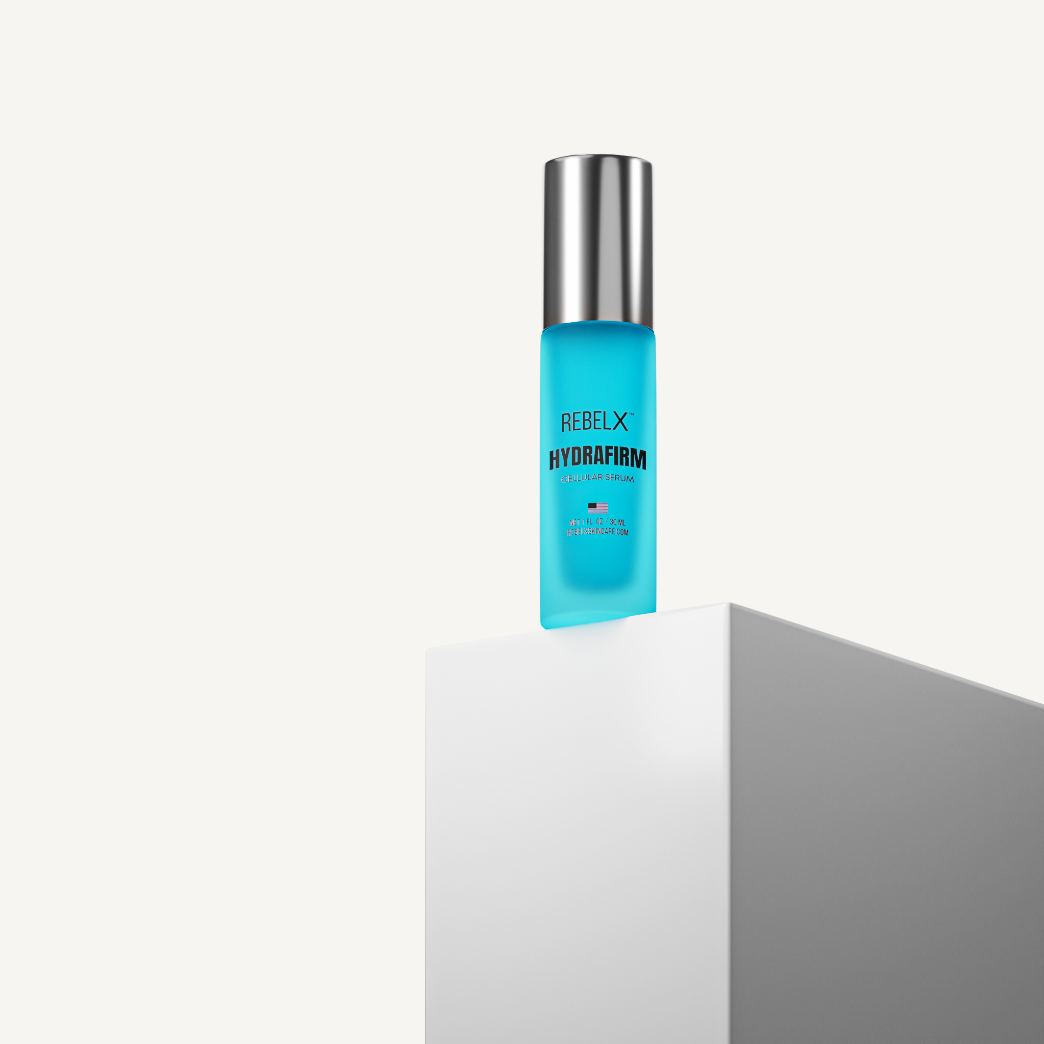 REBELX HydraFirm Cellular Serum in turquoise pump bottle with silver cap displayed on white geometric platform