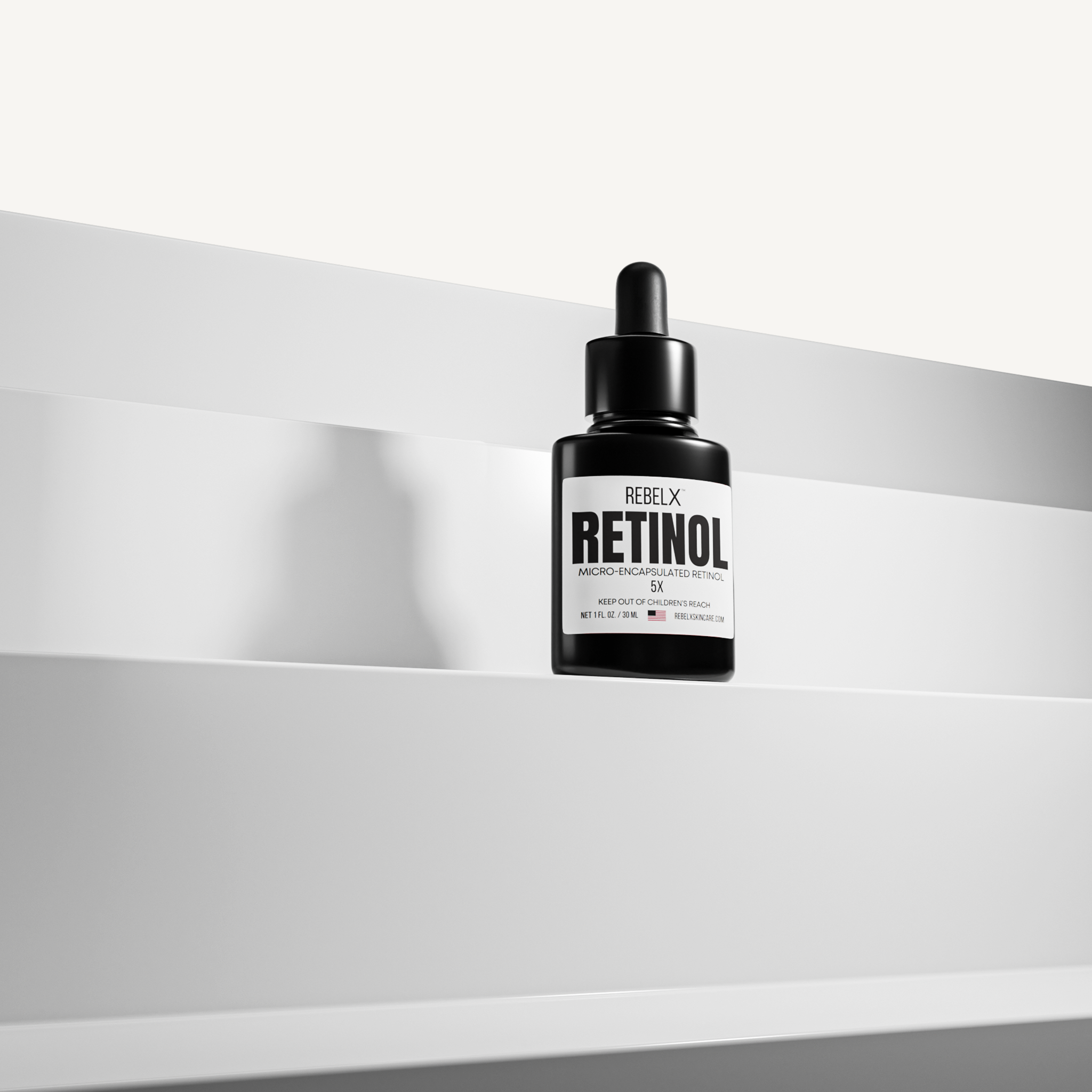 REBELX Retinol serum with micro-encapsulated retinol in black dropper bottle, 1 fl oz size