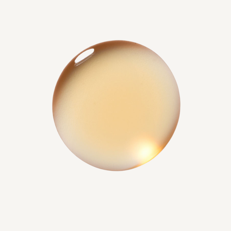 REBELX Retinol serum texture showing golden amber oil droplet on white background