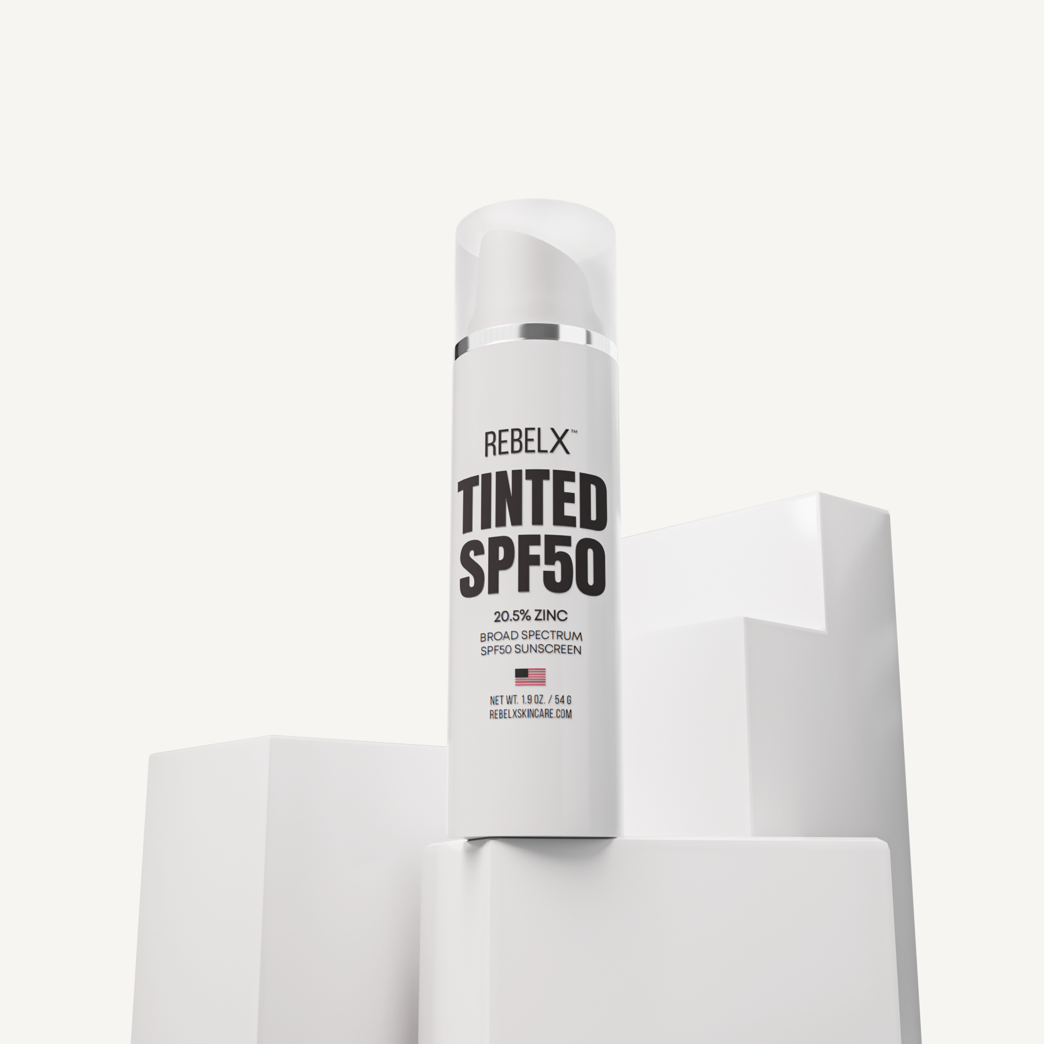 REBELX Tinted SPF50 sunscreen tube with pump dispenser - 20.5% zinc broad spectrum formula, 1.9 oz white packaging