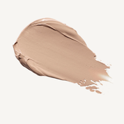 Medium beige tinted moisturizer swatch smeared on white background showing smooth, creamy texture