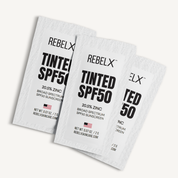 REBEL X tinted SPF50 sunscreen sample packets with 20.5% zinc oxide broad spectrum protection, 0.07 oz travel size sachets made in USA for mature skin sun protection